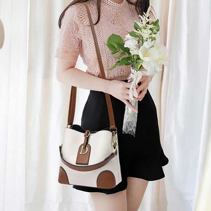 Modeva - Designerinspirerad Vintage Läderhandväska med Hink och Axelrem